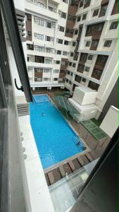 an overhead view of a swimming pool in a building at Be Residences Studio in Cebu City +10 photos