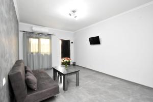 a living room with a couch and a table at Sirik hotel in Zvartnots International Airport +14 photos
