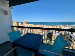 a table and chairs on a balcony with a view at Marenostrum view in Playa Pobla de Farnals
