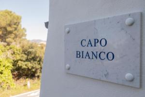 a sign that reads capo blanca on a building at Fuga d'Amore - HelloElba in Portoferraio