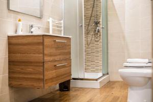 a bathroom with a sink and a shower at casa del sole in Taormina