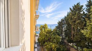 a view of the ocean from a balcony of a building at casa del sole in Taormina