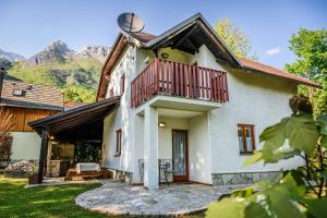 an external view of a house with a balcony at Albatros in Bovec