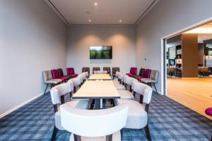 a conference room with a long table and chairs at Premier Inn Stuttgart Feuerbach in Stuttgart