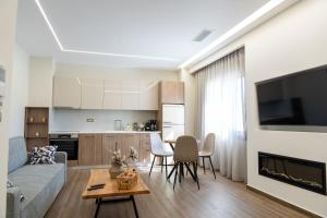 a living room with a couch and a table at Antaia 1 in Nafplio