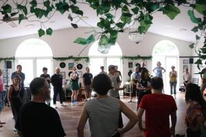 a group of people standing around in a room at The Historic Railway Barracks in Goulburn
