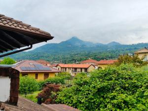 a view of a town with mountains in the background at Casa Jesus - suite home in Almese