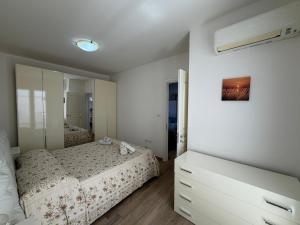 a bedroom with a bed and a large mirror at Casa Ca 'Luci in Marina San Gregorio