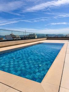 a swimming pool on the roof of a building at L'ADRESSE Boutique Hôtel & SPA Tanger in Tangier