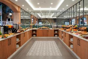 a large kitchen with a lot of food at Expoist Hotel in Beylikduzu +63 photos