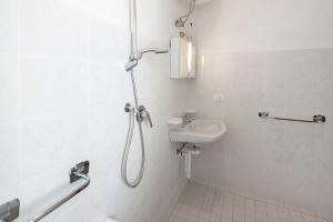 a bathroom with a shower and a sink at Residenza Stella X in Bibione +9 photos