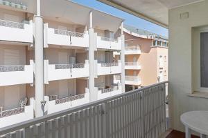 a balcony of a building with white balconies at Residenza Stella X in Bibione