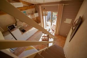 an overhead view of a kitchen and stairs in a house at Tamaris in La Jarrie