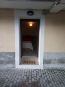 a building with a window with a bed in it at Camera Fenis in Fenis