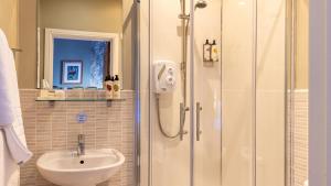 a bathroom with a sink and a shower at The Plough in Alnwick +19 photos