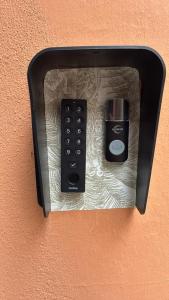 two remote controls are plugged into a wall at Villa Abril en el Porvenir in Seville