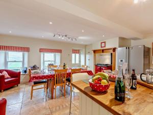 a kitchen and living room with a table and chairs at 4 Bed in Richmond oc-g0083 in Feetham