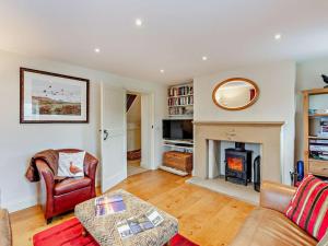 a living room with a couch and a fireplace at 4 Bed in Richmond oc-g0083 in Feetham