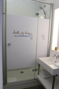 a bathroom with a shower and a sink at First Inn Hotel Blois in Blois +16 photos