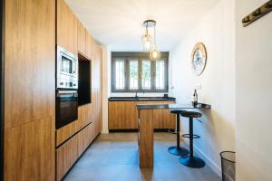 a kitchen with a counter and a sink and a stove at Luis Montoto in Seville
