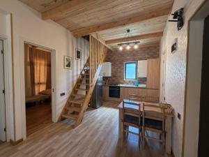 a room with a staircase leading to a kitchen at Tsemi Aura in Tsemi