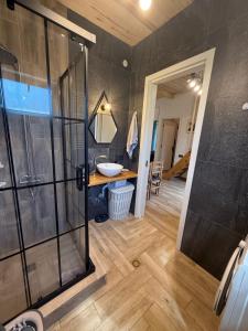 a bathroom with a shower and a sink at Tsemi Aura in Tsemi +11 photos