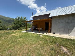 a small building with a table in front of it at Tsemi Aura in Tsemi
