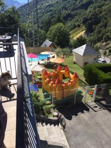 a playground with a toy train in a yard at Appartement Helios confort wifi et terrasse in Barèges