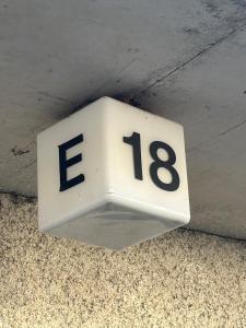a sign on a ceiling with the number at Klintvägen 18 E 31 in Mariehamn