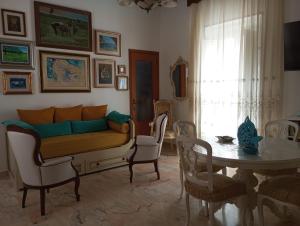 a living room with a couch and a table at Palazzo Sardanelli in Pizzo