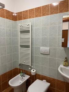 a bathroom with a toilet and a sink at Dimora Dafne in Policoro