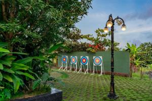 a row of target signs lined up against a fence at Dandeli Kali Resort in Dandeli +1 photo