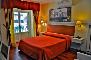 Postel nebo postele na pokoji v ubytování Hotel Rio