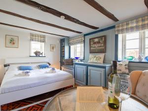 a bedroom with a bed and a table at Haus Quitte in Kühlungsborn +99 photos