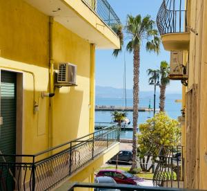 a balcony of a building with a view of the water at VICO 11 Gaeta - UN LETTO IDEALE in Gaeta