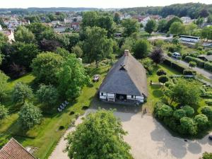 an aerial view of a house with a thatched roof at Haus Quitte in Kühlungsborn