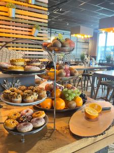 a display of different types of pastries on a table at arte Hotel Kufstein in Kufstein
