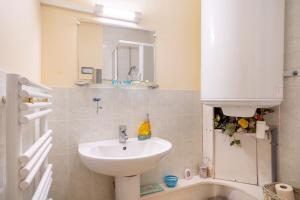 a bathroom with a sink and a mirror and a tub at Kervégant Chambres D'hôtes in Riec-sur-Bélon +39 photos