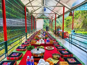 a long line of tables with food on them at Sam Hotel Lào Cai in Pu Chu Chay