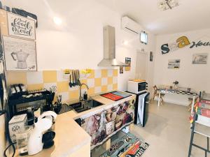 a kitchen with a sink and a counter top at Sea House in Taranto