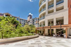 an empty courtyard in front of a building at Steyn City Hotel by Saxon in Midrand
