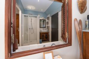 a bathroom with a shower and a sink at Maison D'hôtes De Calzac Moulin - in Le Gorvello +43 photos