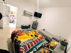 a room with a bed and a couch at Sea House in Taranto