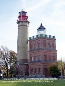 a building with a lighthouse on top of it at Blinkfüer am Kap Arkona in Putgarten +52 photos