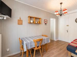 a dining room with a table and chairs at Appartement au cœur de La Clusaz, animaux acceptés - FR-1-304-7 in La Clusaz