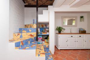 a room with a book shelf with books at Maison familiale 10 personnes in Bannalec +24 photos