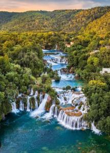 an aerial view of waterfalls in a river at Studio apartman StelLar in Otavice