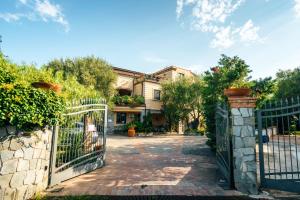 an entrance to a house with a wrought iron gate at Residence e B&B Villamirella in Palinuro