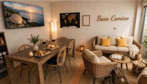 a living room with a table and a couch at VILLA PANGEA - Guest House - Camino del Norte in Castro-Urdiales