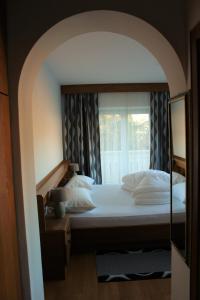 En eller flere senge i et værelse på Garni Hauenstein